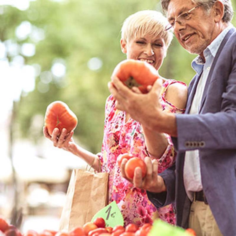 People looking at fruits